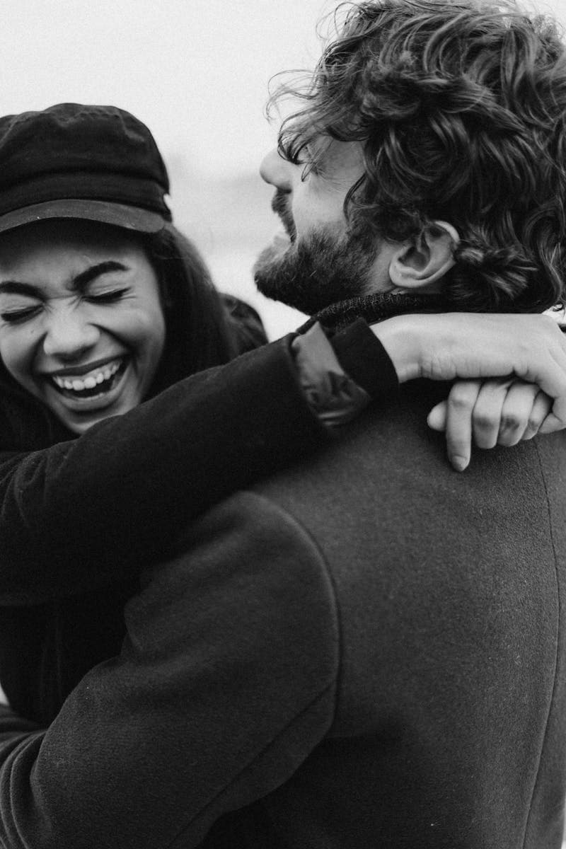 Couple laughing, finding their couple name